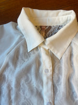 White lace shirt with macramé hem