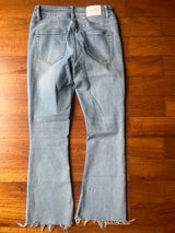 Light flare jeans with frayed hem