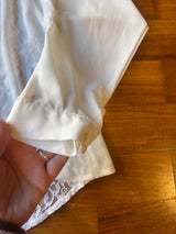 White lace shirt with macramé hem