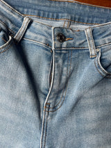 Light flare jeans with frayed hem