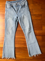 Light flare jeans with frayed hem